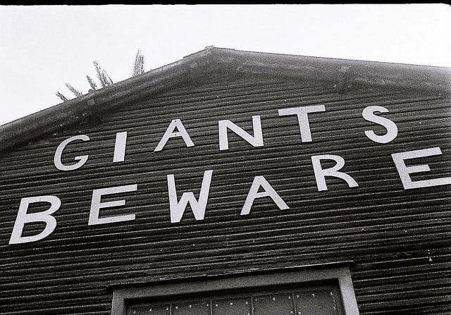Sign on barn "Giants Beware"